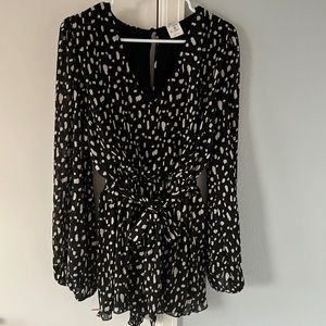 Black romper with a belt